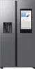 A front view of a modern side-by-side refrigerator with a large touchscreen display on the right door. Produktbild-Vorschau