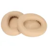 Two beige ear pads for headphones are shown on a white background. Podgląd zdjęcia produktu