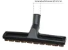 A close-up studio shot of a black vacuum cleaner floor brush attachment with bristles. Produktbild-Vorschau