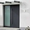 A modern front door with a glass side panel and a large metal handle. Náhled obrázku produktu