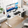 A modern standing desk setup with dual monitors, a laptop, and computer peripherals. Anteprima dell’immagine prodotto