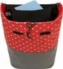 A close-up view of the top opening of a polka-dot patterned bag. Produktbild-Vorschau