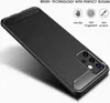 A black phone case with a brushed texture and carbon fiber accents is displayed on a white background. Produktbild-Vorschau