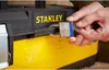 A person's hands are shown locking a toolbox with a padlock. Anteprima dell’immagine prodotto