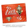 A product image showing a beer advent calendar with a Santa Claus on a motorcycle graphic, with text describing its delivery and assembly. Produktbild-Vorschau
