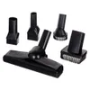 A collection of black vacuum cleaner attachments arranged on a white background. Anteprima dell’immagine prodotto