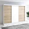 A modern wardrobe with sliding doors in a room setting. Produktbild-Vorschau