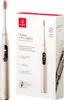 A product shot of an Oclean X Pro Digital Sonic Electric Toothbrush and its packaging. Voir les images du produit
