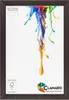 A dark brown picture frame with a white mat and a colorful paint splash design. Produktbild-Vorschau