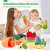 A mother and baby are playing with plush fruit and vegetable toys. Produktbild-Vorschau