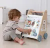 A baby playing with a wooden walker toy. Náhled obrázku produktu