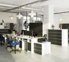An office environment with desks, chairs, and computers. Produktbild-Vorschau