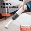 A hand holding a white wireless vacuum cleaner on a carpeted floor. Produktbild-Vorschau