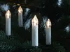LED Christmas candle lights on a Christmas tree. Produktbild-Vorschau