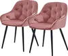 Two pink velvet chairs with black metal legs are shown against a white background.