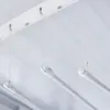 Close-up view of a white ceiling-mounted clothes dryer with pull cords. Náhľad obrázku produktu