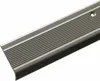 A close-up, angled view of a silver-colored metal stair nosing profile with a black rubber insert, set against a white background. Podgląd zdjęcia produktu