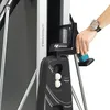 A close-up view of a person's hand interacting with a table tennis table, showing a ball holder and a watch on the person's wrist. Produktbild-Vorschau