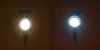 Two solar ground spotlights are shown, one emitting warm white light and the other cool white light. Produktbild-Vorschau
