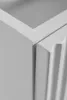 Close-up of the corner of a white cabinet, showing the join between two panels. Náhled obrázku produktu