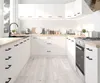 A modern white kitchen with wooden countertops. Podgląd zdjęcia produktu