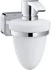 A wall-mounted soap dispenser with a frosted glass container and a chrome pump. Anteprima dell’immagine prodotto