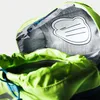 Close-up view of the inside of a green backpack, showing a name tag and the opening of a compartment. Produktbild-Vorschau