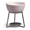 A pink ceramic bowl on a black metal stand, designed for wax melting. Produktbild-Vorschau