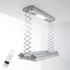 A ceiling-mounted electric clothes dryer with a remote control. Náhľad obrázku produktu
