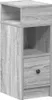 A tall, narrow nightstand with a drawer and open shelves, shown against a light gray background. Náhľad obrázku produktu
