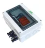 A white electrical junction box with a transparent lid, showing internal components and external connectors. Náhled obrázku produktu