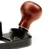 A close-up shot of a wooden handle attached to a black metal tool, isolated on a white background. Podgląd zdjęcia produktu
