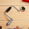 A hand drill is placed on a wooden surface. Produktbild-Vorschau