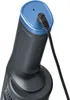 Close-up of the top of a handheld vacuum cleaner, showing the charging port with a cable plugged in. Produktbild-Vorschau