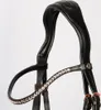 A close-up studio shot of a black horse bridle with rose gold hardware and crystal embellishments. Náhľad obrázku produktu