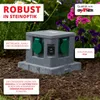 A garden power outlet disguised as a stone cube, placed outdoors among plants. Produktbild-Vorschau