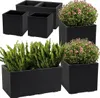 A collection of black planters with plants and flowers. Produktbild-Vorschau