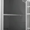 Interior view of a cabinet or shelf unit, showing a shelf and the side of the unit. Náhled obrázku produktu