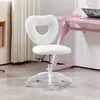 A white heart-shaped office chair with a plush texture is shown in a room setting, next to a pink desk. Podgląd zdjęcia produktu
