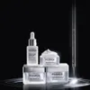 A collection of Filorga skincare products arranged on a dark, reflective surface with dramatic lighting. Anteprima dell’immagine prodotto