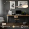 A modern LED floor lamp with a flexible neck is shown in a home office setting, with icons indicating its features. Náhľad obrázku produktu