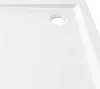 A close-up view of a white shower tray with a drain hole. Náhľad obrázku produktu