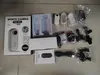 A collection of sports camera accessories and packaging laid out on a floor. Produktbild-Vorschau