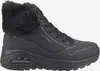 A black Skechers boot with a fur trim is shown against a white background. Produktbild-Vorschau