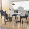 A dining set with a marble-effect table and four upholstered chairs in a modern dining room setting.