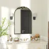 A bathroom vanity with a mirror, sink, faucet, and various decorative items. Podgląd zdjęcia produktu