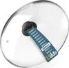 A glass lid for a pot or pan, with a size guide tag attached. Produktbild-Vorschau