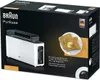 The image shows the packaging of a BRAUN toaster. The packaging features a picture of the toaster and some toast with butter. Náhled obrázku produktu