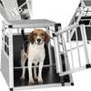 A beagle dog stands inside an aluminum dog crate with the door open. Náhled obrázku produktu