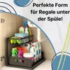 A two-tier sliding organizer filled with cleaning supplies and bottles stored under a sink. Produktbild-Vorschau